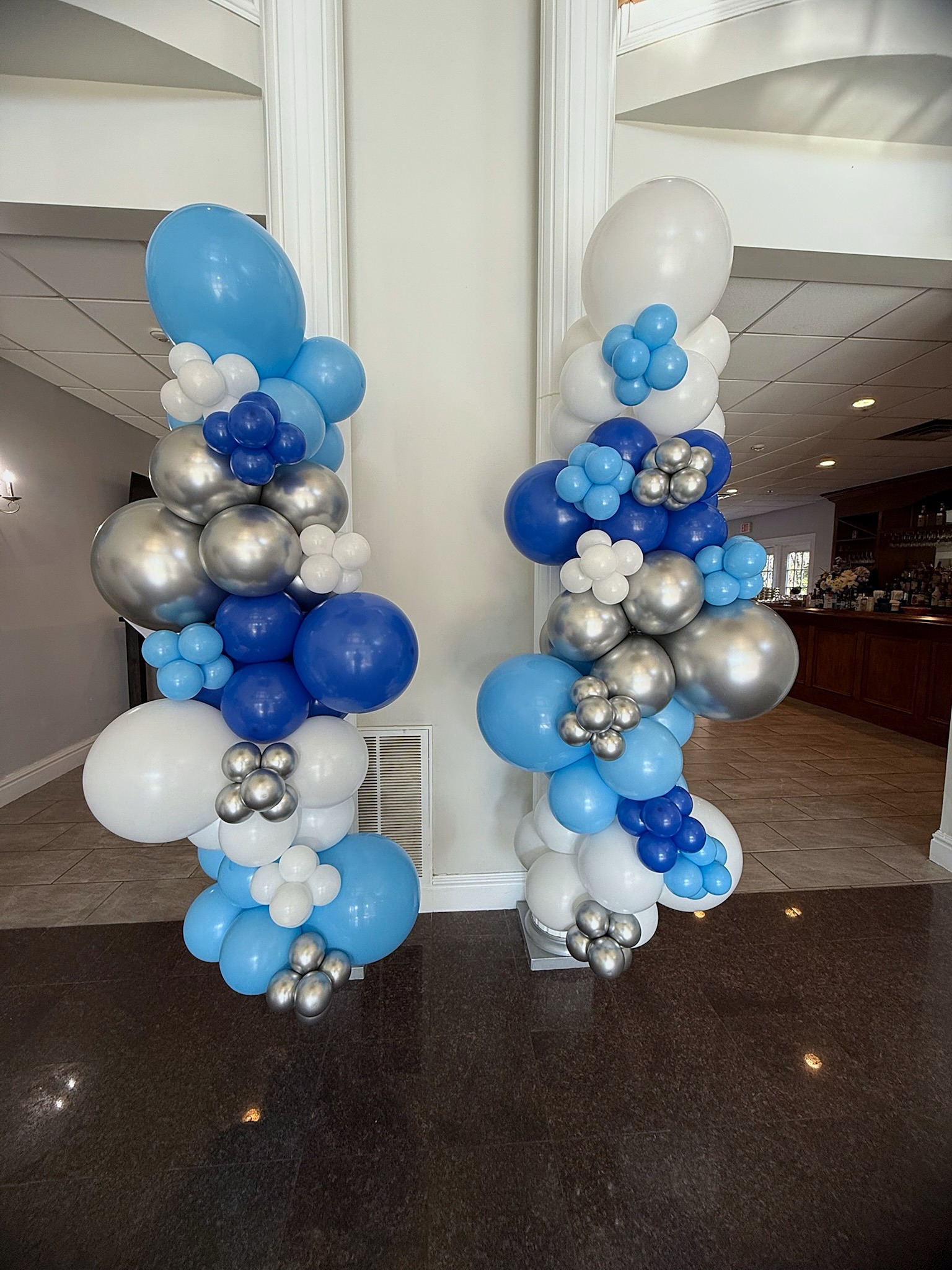 Blue white and silver organic balloon columns